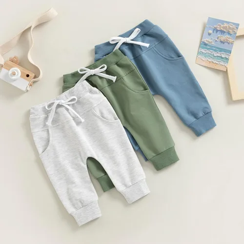 Vista 2 de Mubineo Pantalones deportivos básicos lisos para bebés, niños y niñas, cómodos pantalones de algodón con bolsillos