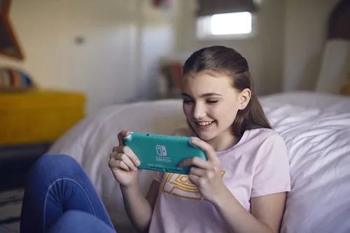 Vista 5 de Nintendo Switch Lite - Turquoise (Renewed Premium)