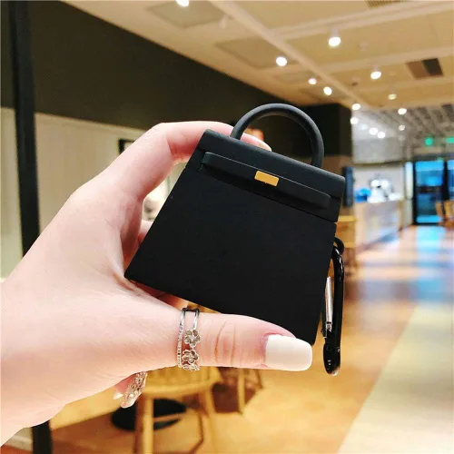 Vista 2 de Compatible con auriculares Airpods 1 y 2, diseño de bolsa de mano de moda, protector de auriculares inalámbricos, silicona suave, accesorios a Negro