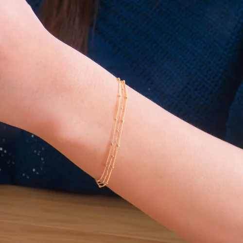 Vista 2 de Pulsera de cadena de elegante oro para mujer, pulseras de cadena individual o en capas, con eslabón de dije de corazón, karma, triángulo, perlas