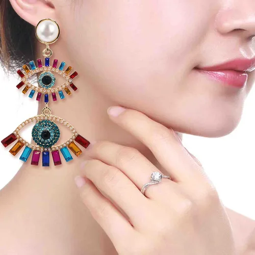 Vista 4 de Aretes colgantes de cristal para mujer, diseño de ojos malvados y divertidos, con diamantes de imitación abstractos y ojos colgantes, joyería