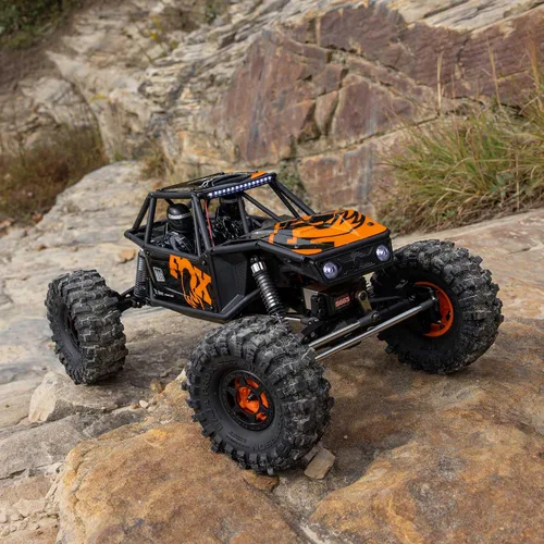 Vista 7 de Axial RC Crawler 1/10 UTB10 Capra 1.9 4WS 4X4 RTR Crawler de roca con cepillo, naranja, AXI-1543T1