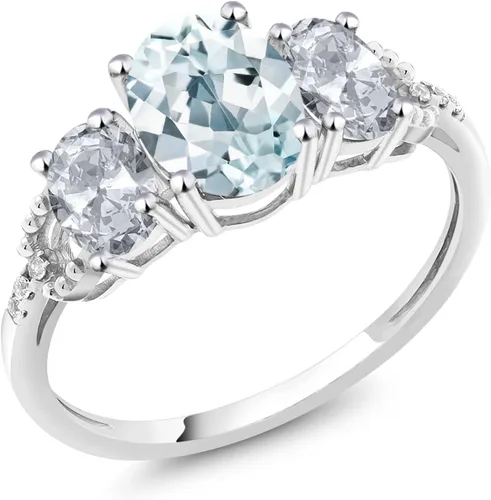 Vista 19 de Anillo de compromiso ovalado de oro blanco de 10 quilates con piedra natal y topacio blanco de 3 piedras con detalles de diamante Centro de 0.315