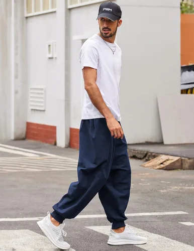 Vista 2 de COOFANDY Pantalones de harén hippie para hombre, holgados, de lino, bohemio, para yoga, casual, con entrepierna caída, pantalones