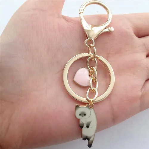 Vista 4 de Lindo llavero de gatito blanco con corazón de amor para mujer, joyería creativa para amantes de los gatos