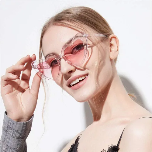 Vista 2 de Dollger Lentes de sol con forma de corazón para mujer, estilo retro, diseño de ojo de gato, UV400