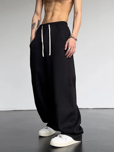 Vista 4 de OYOANGLE Pantalones deportivos holgados con cordón y cintura elástica Y2K para hombre, pantalones largos sueltos de pierna ancha con bolsillo