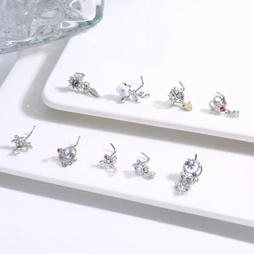 Vista 6 de Dochias - 9 aretes colgantes de nariz de 20 G para mujer, de acero inoxidable, en forma de L, corazón, flecha, plumas, copo de nieve, ala de copo