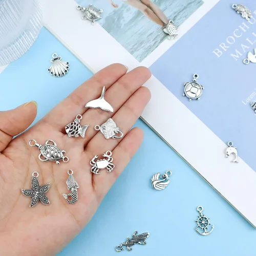Vista 3 de JIALEEY Venta al por mayor 100 piezas mezcla de plata antigua encanto colgante colección DIY suministro de joyería para collar pulsera colgante