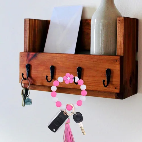 Vista 3 de Elegante pulsera de silicona con cuentas para mujer, llavero con clip de oro, soporte multifuncional para llaves