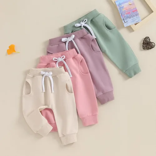 Vista 2 de Mubineo Pantalones deportivos básicos lisos para bebés, niños y niñas, cómodos pantalones de algodón con bolsillos