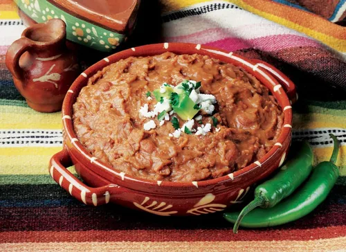 Vista 4 de Amy's Frijoles refritos orgánicos enlatados, frijoles tradicionales ligeros en sodio, veganos sin gluten y vegetarianos, 15.4 onzas (paquete de 12)