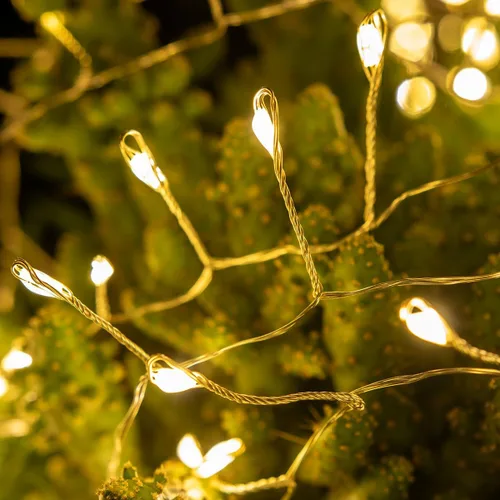 Vista 2 de Luces de Hadas en Racimo 10FT Luces de Cadena Petardo 100 LED Blanco Cálido Enchufable Interior Cable Plateado Luces de Cadena con Control Remoto
