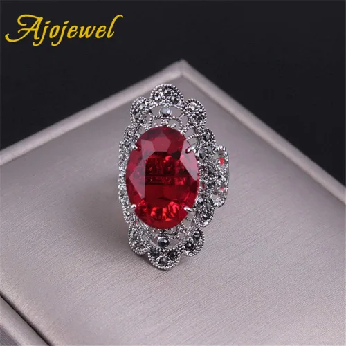 Vista 2 de Anillos grandes ovalados de cristal rojo para las mujeres ahuecan hacia fuera flor diseño dedo joyería vintage anel