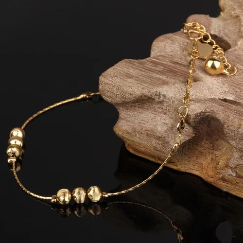 Vista 3 de Tobillera para mujer tono dorado de 18 quilates con cuentas de la suerte, cadena de hueso de serpiente, accesorio ajustable de 9.4in de largo