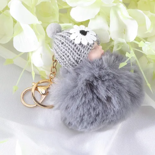 Vista 3 de Garneck Doll Pom Pom Llavero lindo mullido bebé muñeca llavero pompón mujeres coche llavero cartera bolsa teléfono colgante bolsa encanto gris