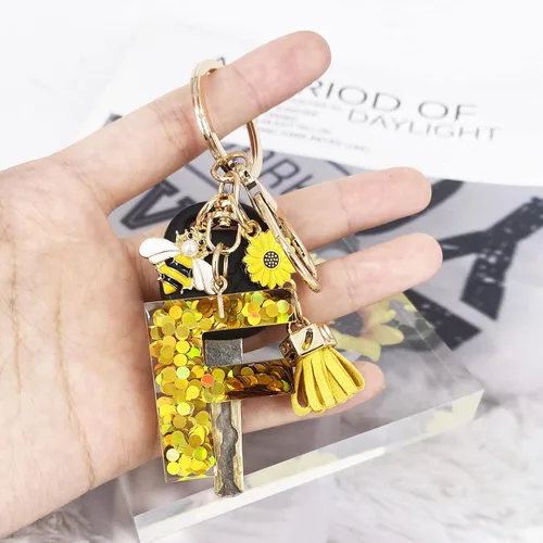 Vista 4 de LAXPICOL Llavero dorado de la letra A-Z para mujer, monedero, bolsos, miel, abeja, lentejuelas doradas, letras iniciales del alfabeto
