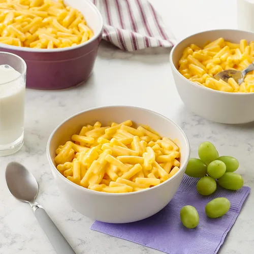 Vista 4 de Annie’s Macarrones y queso vegano con arroz y sabor a cheddar con pasta orgánica sin gluten, 6 onzas (paquete de 12)