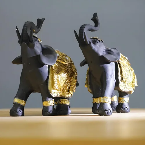 Vista 2 de Juego de decoración de elefante de la suerte con troncos – Feng Shui resina negro y dorado pareja elefante figuritas – Par de estatuas de elefantes