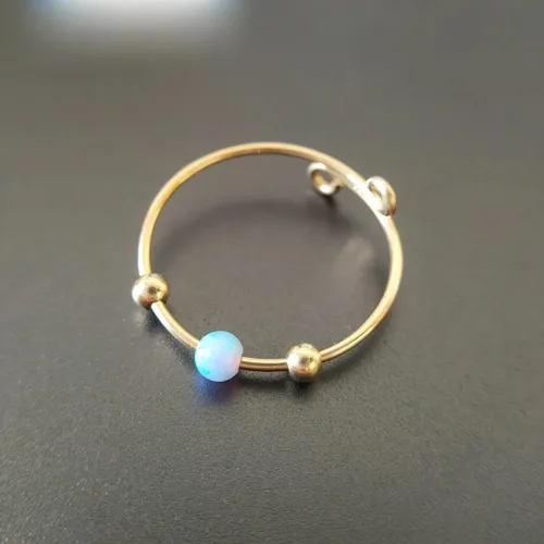 Vista 4 de Anillo de ansiedad anti estrés oro alivio del estrés Fidget preocupación anillo ajustable ópalo azul anillo giratorio chapado en oro