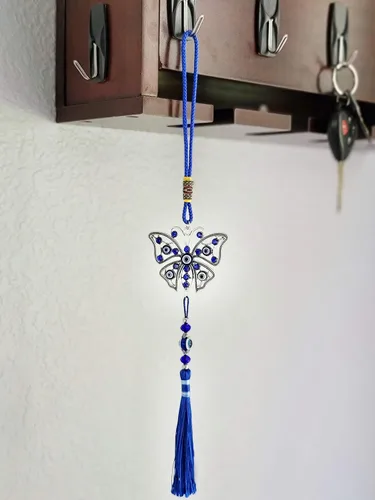 Vista 3 de LUCKBOOSTIUM Dijes de mariposa con diseño de ojo turco central en piedra de cristal azul con borlas para buena suerte, protección y bienestar