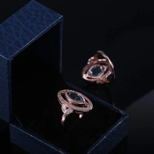 Vista 4 de Anillo de compromiso para mujer, chapado en oro rosa y oro blanco, corte marquesa de imitación azul aguamarina CZ