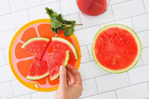 Vista 6 de Dexas Citrus Slice Tabla de cortar/tabla de servir 9 pulgadas, pomelo