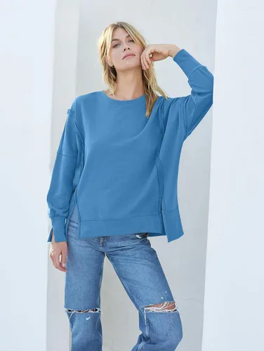 Vista 2 de MEROKEETY Sudadera holgada casual de manga larga tipo farol para mujer, cuello redondo, abertura lateral, 2023