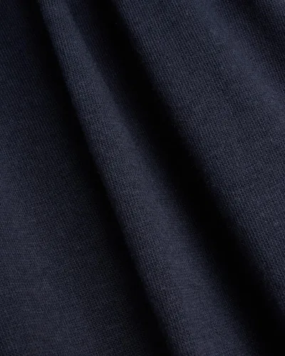Vista 6 de Reebok Pantalones deportivos para hombre - Pantalones deportivos ligeros de ajuste clásico con parte inferior abierta (S-XL)