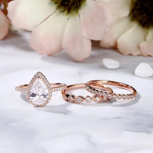 Vista 3 de Jeulia Juego de anillos de boda en forma de pera 3 piezas de plata de ley con corte de pera de halo de diamantes de oro rosa, anillo de boda