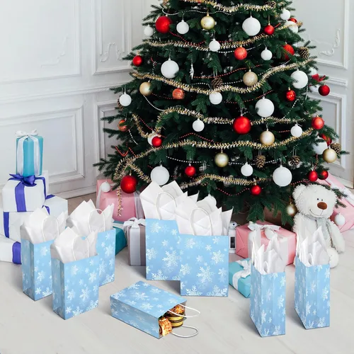 Vista 7 de Jectivs Paquete de 24 bolsas de regalo para fiestas, bolsas grandes y gruesas de papel kraft blanco con copos de nieve azul hielo con tejido blanco