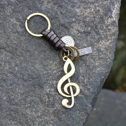 Vista 2 de AuPra Llavero de música, regalos para mujeres y hombres, llaveros de cuero para el hogar y la puerta del automóvil, soporte para llaves de niña