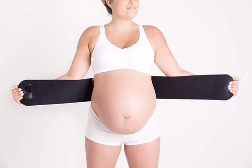 Vista 2 de CABEA Babybellyband - Cinturón de maternidad 2 en 1 original para embarazo, ajustable para embarazo y posparto que proporciona alivio y apoya