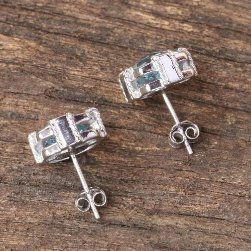Vista 4 de NOVICA Aretes artesanales hechos a mano con topacio azul, chapados en rodio de Tailandia, plata de ley 925, piedra preciosa con piedra natal