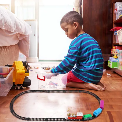 Vista 3 de Juego de tren eléctrico navideño para pista de ferrocarril de plástico y maleta portátil, superficie lisa segura para niños y colores brillantes que