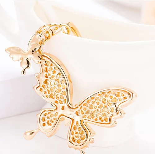 Vista 2 de Llavero de coche para hombres y mujeres, llavero de mariposa, llavero multifuncional, bonitos accesorios para mujeres, color blanco