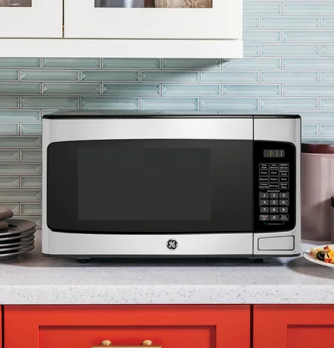 Vista 7 de GE Horno microondas para encimera, compacto de 1.1 pies cúbicos, capacidad de 950 vatios, 6 ajustes de cocción automática, tecnología de bloqueo