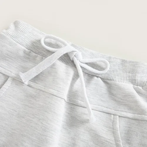 Vista 5 de Mubineo Pantalones deportivos básicos lisos para bebés, niños y niñas, cómodos pantalones de algodón con bolsillos