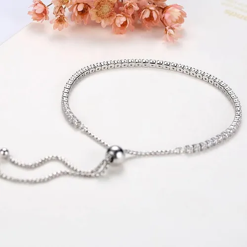 Vista 4 de Delicada pulsera de tenis de moissanita de oro de 18 quilates con diamantes completos de una sola fila y deslizador ajustable, regalo del día