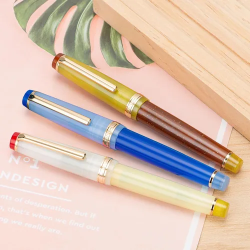 Vista 7 de 3 Jinhao 82 Pluma estilográfica acrílica transparente de color clásico mixto con punta media y borde dorado, con juego de conversor Mezcla clásica