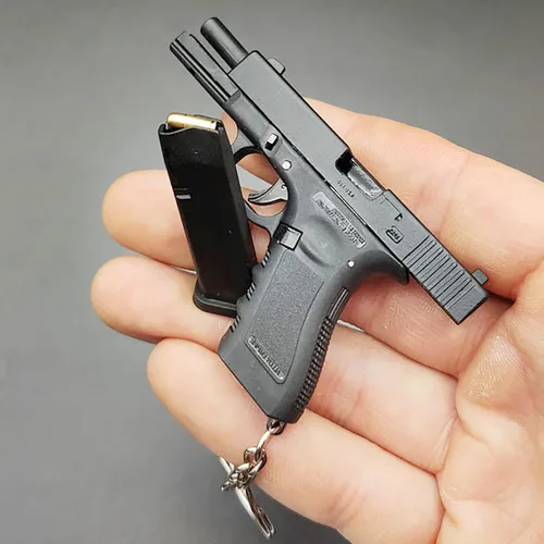 Vista 2 de Mini llavero de pistola, llavero con forma de pistola, llavero táctico pequeño con forma de pistola, regalo con colgante en forma de armas, llaveros