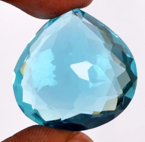 Vista 4 de GEMHUB Topacio azul de aproximadamente 70.00 a 80.00 ct en forma de pera topacio creado en laboratorio para la fabricación de joyas, Gema, Brasilia