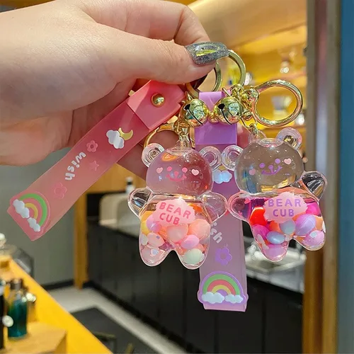 Vista 8 de Llavero Kawaii con diseño de oso líquido flotante de arena movediza, lindo llavero, bolsa, pulsera con dije para mujeres y niñas