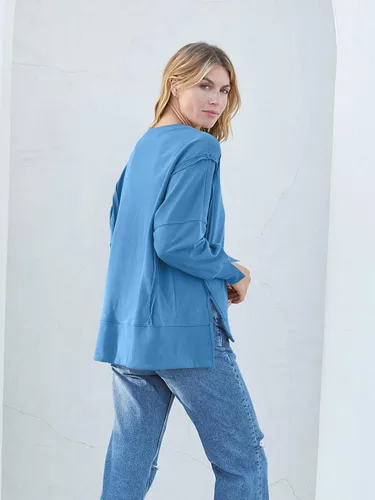 Vista 3 de MEROKEETY Sudadera holgada casual de manga larga tipo farol para mujer, cuello redondo, abertura lateral, 2023