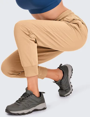 Vista 5 de CRZ YOGA Pantalones deportivos para mujer, impermeables, para exteriores, golf, atléticos, ligeros, con bolsillos con cremallera, de 27 pulgadas
