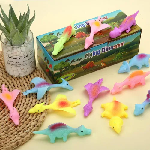 Vista 4 de 20 Piezas Juguetes de Dedo de Dinosaurio con Tirachinas, Juguetes de Halloween Regalos de Fiesta para Niños Goma Pegajosa Dino Catapulta Voladora