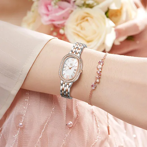 Vista 2 de SHENGKE SK - Reloj de pulsera de acero de aleación sólida con detalles de cristal ovalado para mujer