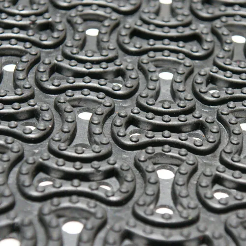 Vista 6 de Rubber-Cal 03-236-DR "DuraScraper Drainage", tapete comercial para entrada de 3/8" de grosor x 24" x 36", color negro.