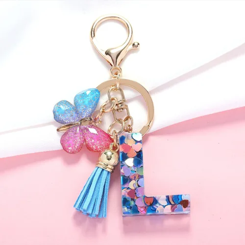 Vista 2 de Llavero de letra inicial del alfabeto de moda, borla y mariposa, llavero para bolso, bolsos de mano para mujeres y niñas