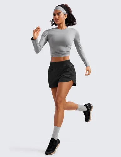 Vista 4 de CRZ YOGA Pantalones cortos para correr para mujer, talle alto, con bolsillo con cremallera, forro de malla, entrepierna de 3 pulgadas, dobladillo